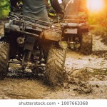 man-riding-atv-vehwwicle-on-260nw-1007663368